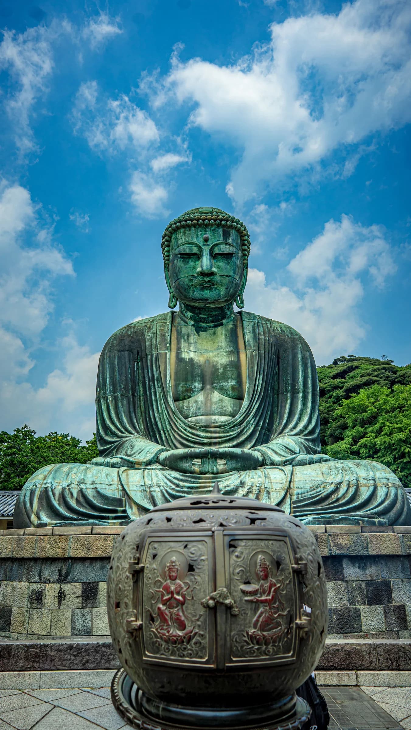 The bronze Great Buddha of Kamakura beneath a blue sky