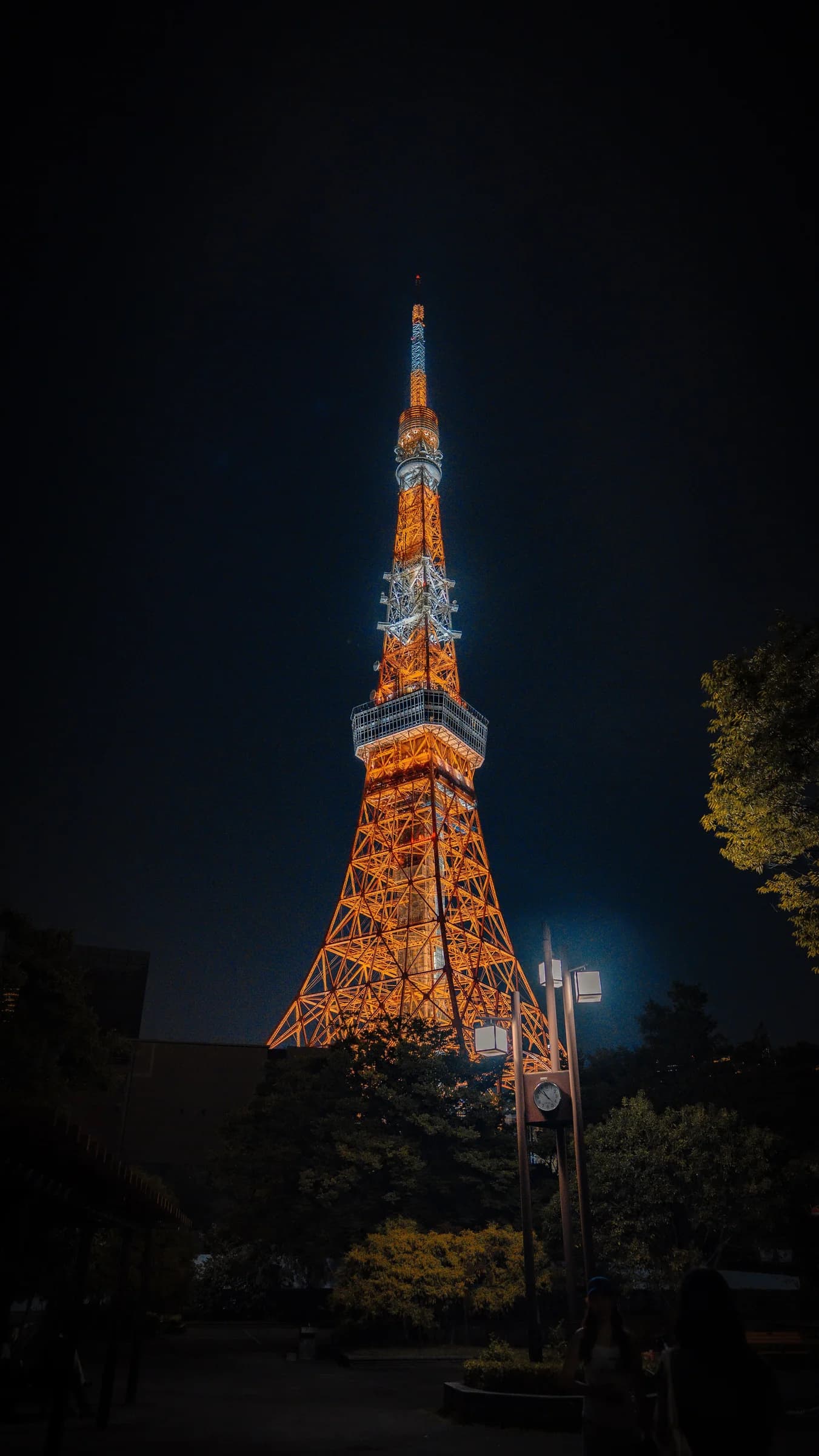 Tokyo Tower glowing orange against the night sky